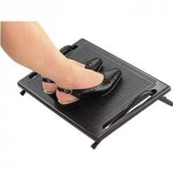 Womans feet resting on footrest