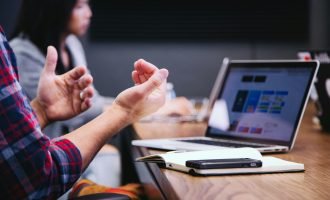 Example of someone sitting at a desk incorrectly